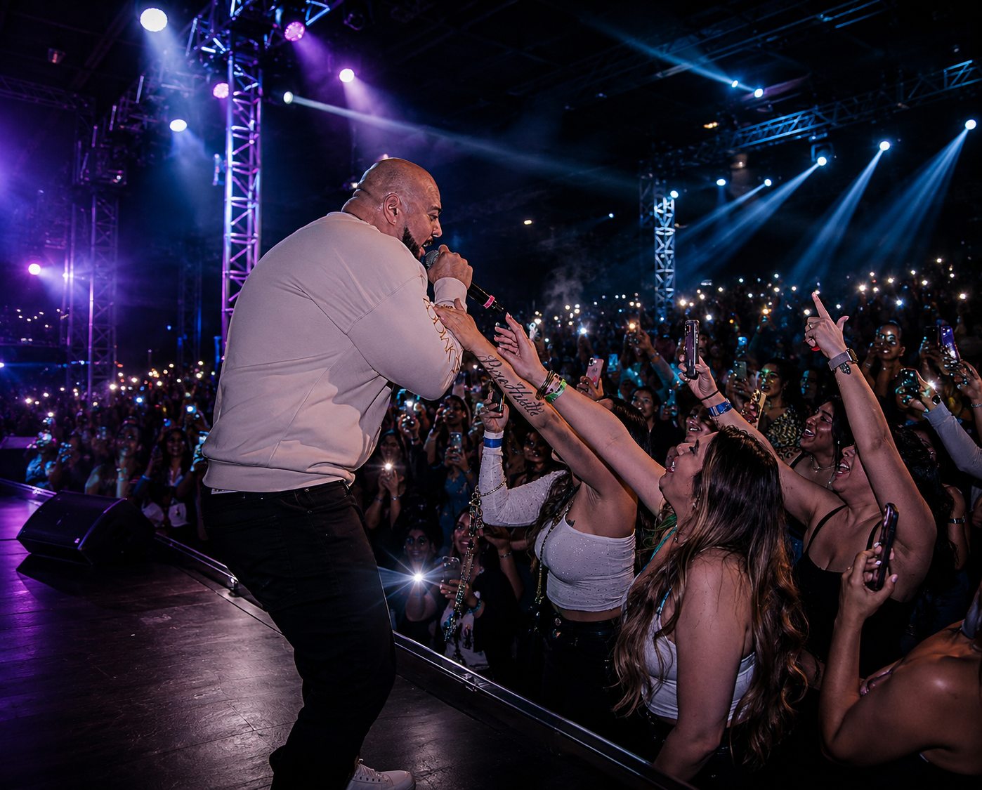 Big Gemini performing live on stage in front of a packed crowd